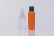Hair Serum in a glass bottle and orange bottle