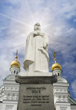 Princess Olga's monument with Kiev-Pechersk Lavra Church. The inscription is that Russian people believe she will be the first representative of Kyiv Rus to enter the kingdom of heaven.