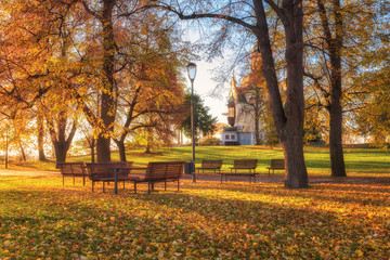 Golden autumn in Prague, famous tourist destination Letna park (Letenske sady) in sunlight with Hanavsky pavilion and nice place for relax, Czech Republic