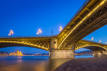 Budapest, Hungary - The Beautiful Illuminated Margaret Bridge With The Parliament Of Hungary At Blue Hour