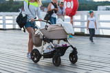 Fototapeta  - kobieta z wózkiem dziecięcym