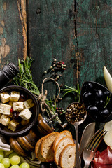 Wall Mural - Tasty Italian Greek Mediterranean Food Ingredients Top View on Green Old Rustic Table Above