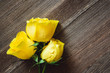 Yellow Roses on Rustic Wooden Table
