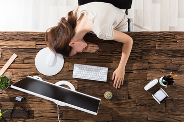 Businesswoman Sleeping In Office