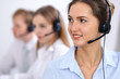 © rogerphoto - Call center. Focus on beautiful business  woman in headset
