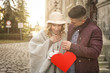 © liderina - Happy couple outdoor. Happy couple enjoying in the city. Boyfriend  giving bouquet roses to his girlfriend.