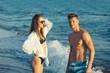 © Mediteraneo - Young happy  couple  on beach smiling