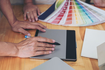 Poster - Young colleagues designers working together on a creative project and color samples for selection, Color swatch samples, Brainstorming Planning Partnership, creative graphic design working desktop