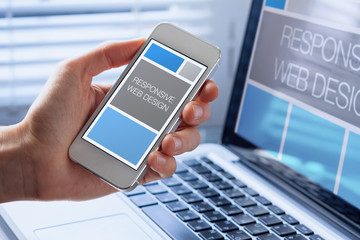 designer sketching responsive web design website, smartphone screen, fluid grid