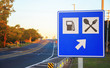 © Vinícius Bacarin - Road sign at the roadside signaling a gas station and food services on highway
