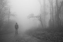 Man On Foggy Road