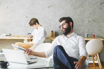 Canvas Print - Thoughtful businessman using laptop