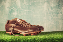 Retro Outdated Soccer Or Football Spike Boots. Vintage Old Style Filtered Photo