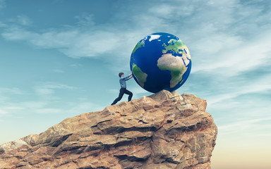 man pushing a big earth globe
