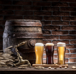 Sticker - Glasses of beer and ale barrel on the wooden table. Craft brewery.