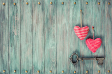 Pair Of Love Hearts And Old Rusty Key On Wooden Vintage Background. Retro Style Filtered Photo
