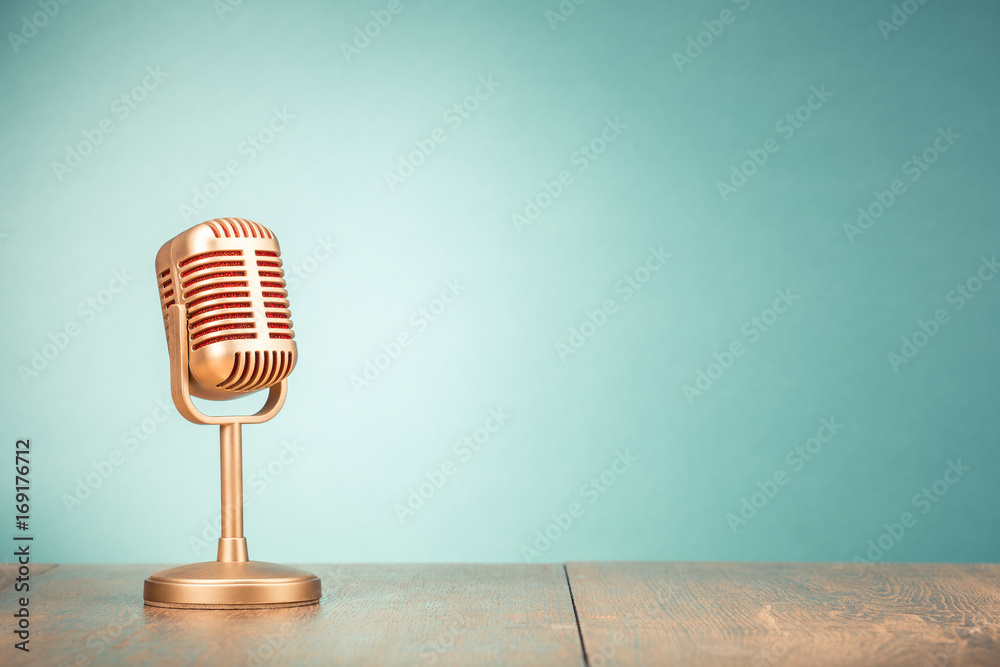 Retro golden microphone for press conference or interview on table front gradient mint green background. Vintage old style filtered photo - obrazy, fototapety, plakaty 