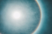 Natural Phenomenon In Which The Sun Has A Beautiful Rainbow Edge Over The Beautiful Sky.