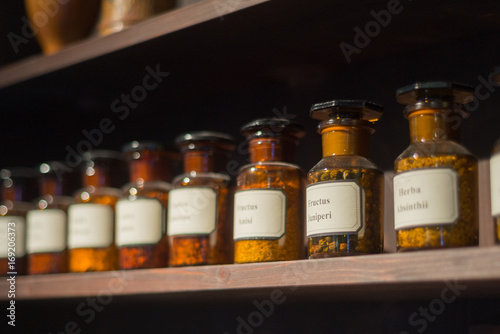 Vintage alchemy chemistry workshop rack shelf and glass vials ingredients Poster