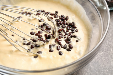 Sticker - Bowl with raw dough and chocolate dragee, closeup