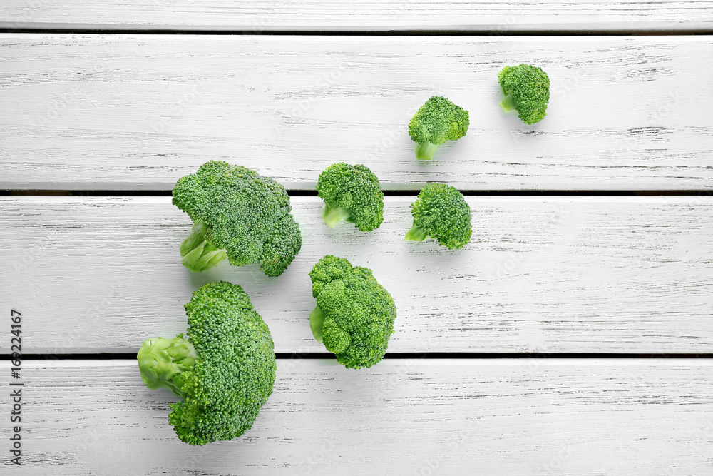 Fresh green broccoli on wooden background