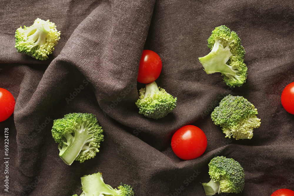 Fresh green broccoli with tomatoes on napkin