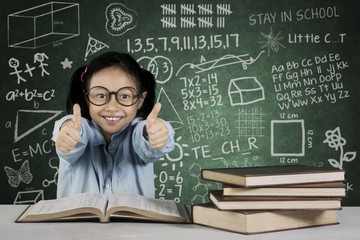 Wall Mural - Girl showing ok sign with books and scribble