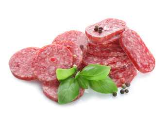 Wall Mural - Delicious sliced sausage with basil and peppers on white background