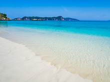 Clear Sandy Beach, Turquoise Sea And Blue Sky For Summer Vacation.