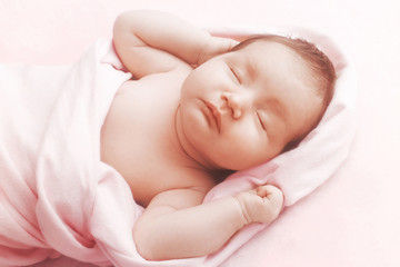 Wall Mural - Newborn baby girl sleep on pink blanket