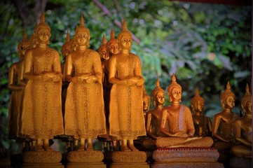 Low light mode for raw of Gold Buddha Statues in Thailand, Asia