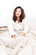 © ukimurakung - Beautiful woman waking up in her bed in the bedroom, she is smiling after wake up.