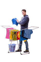 Wall Mural - Husband man doing laundry isolated on white