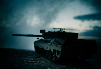 War Concept. Military silhouettes fighting scene on war fog sky background, World War German Tanks Silhouettes Below Cloudy Skyline At night. Attack scene. Armored vehicles. Tanks battle scene