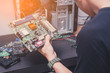 The abstract image of the technician hold the outdated computer mainboard for repairing. the concept of computer hardware, repairing, upgrade and technology.