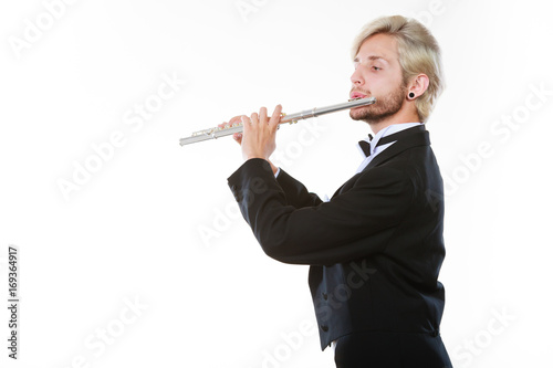 Zdjęcie XXL Płci męskiej flecista na sobie frak odgrywa flet