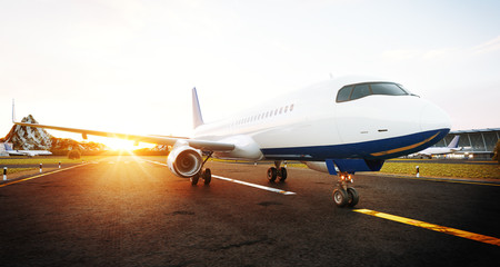 Wall Mural - White commercial airplane standing on the airport runway at sunset. Front view of passenger airplane is taking off. Airplane concept 3D illustration.