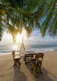 Fototapeta  - Sitting place and table in a tropical beach