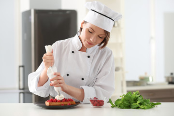 Sticker - Female chef decorating dessert in kitchen