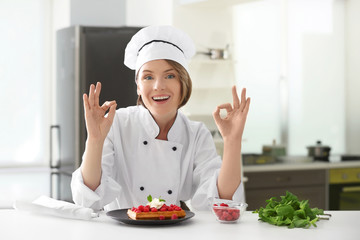 Sticker - Female chef with tasty dessert in kitchen