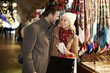 © gpointstudio - COuple shopping in the market square