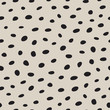 © souloff - Irregularly placed dots seamless vector pattern. Speckles and spots fashionable texture. Endless repeated chic background for print, textile, or web.
