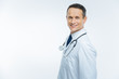 © Viacheslav Yakobchuk - Radiant mature practitioner with stethoscope posing for camera