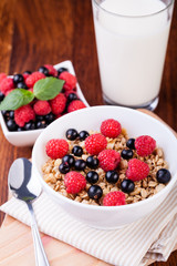 Wall Mural - muesli breakfast on a wooden table