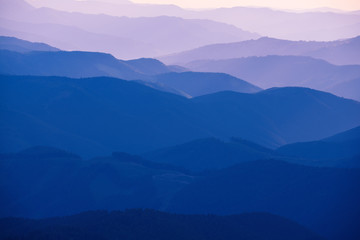 Wall Mural - Carpathian mountains summer sunset landscape with abstract gradient of mountain peaks in blue colors, natural travel outdoor background