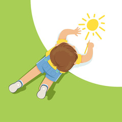 Wall Mural - Little boy lying on floor and drawing sun using pencil, top view of child on the floor