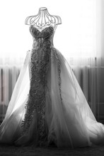 Black And White Picture Of Rich Wedding Dress Put On Mannequin