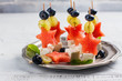 Little skewers with water melon and feta cheese. Copy space