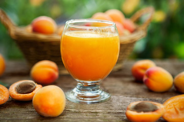 Wall Mural - Fresh apricot juice in glass