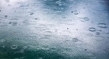 Abstract Background, Rain Drops On The Water